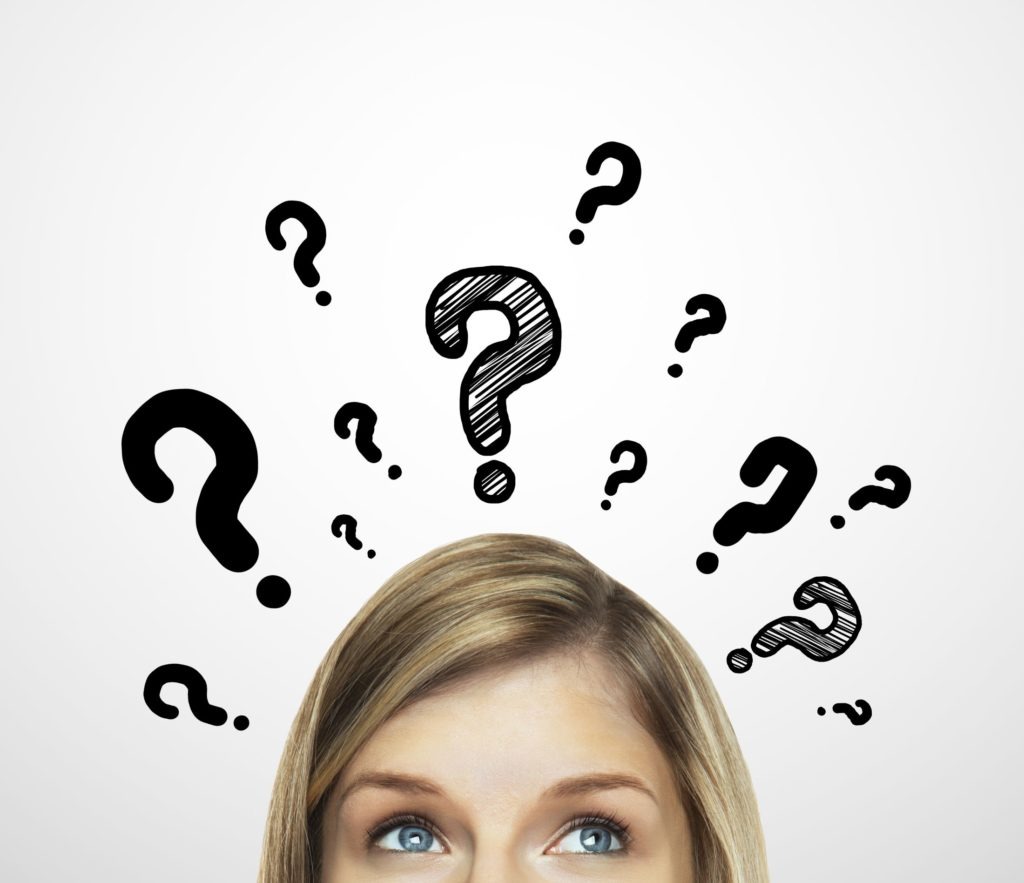 question marks surrounding a woman