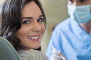 Woman at dentist's office smiling