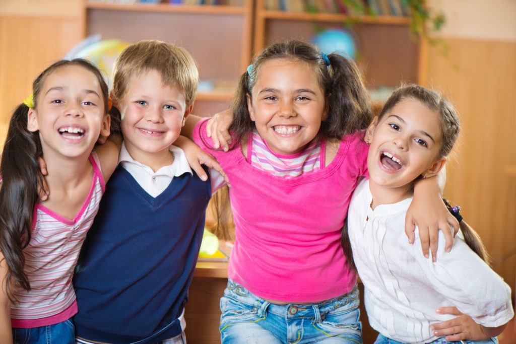 Four smiling children